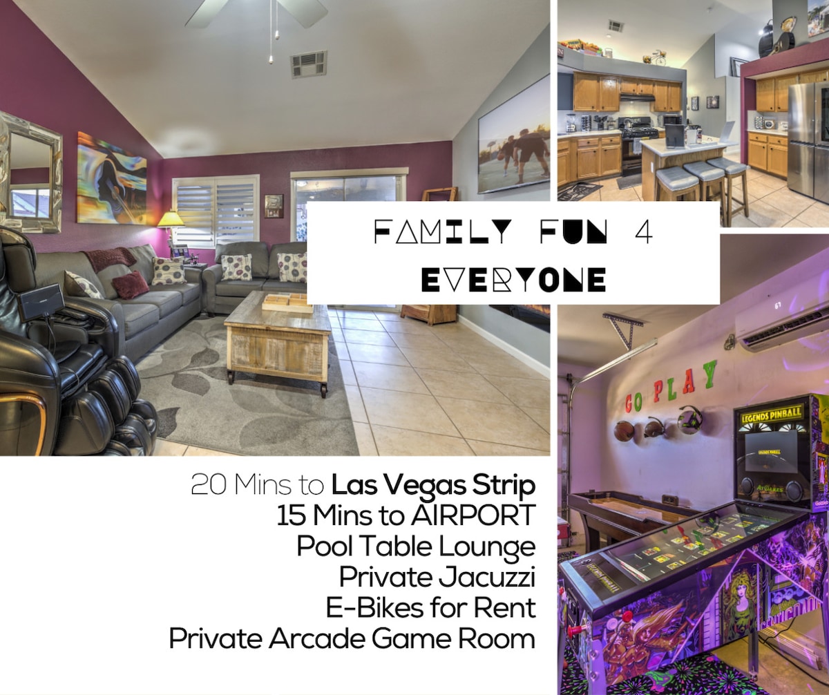 A living area showcases a spacious setup with comfortable seating and a neutral-toned rug. Dark purple walls contrast with light decor, creating an inviting space. Nearby, a fully equipped kitchen features wooden cabinetry and modern appliances, while an arcade game room is visible, filled with vibrant game machines.