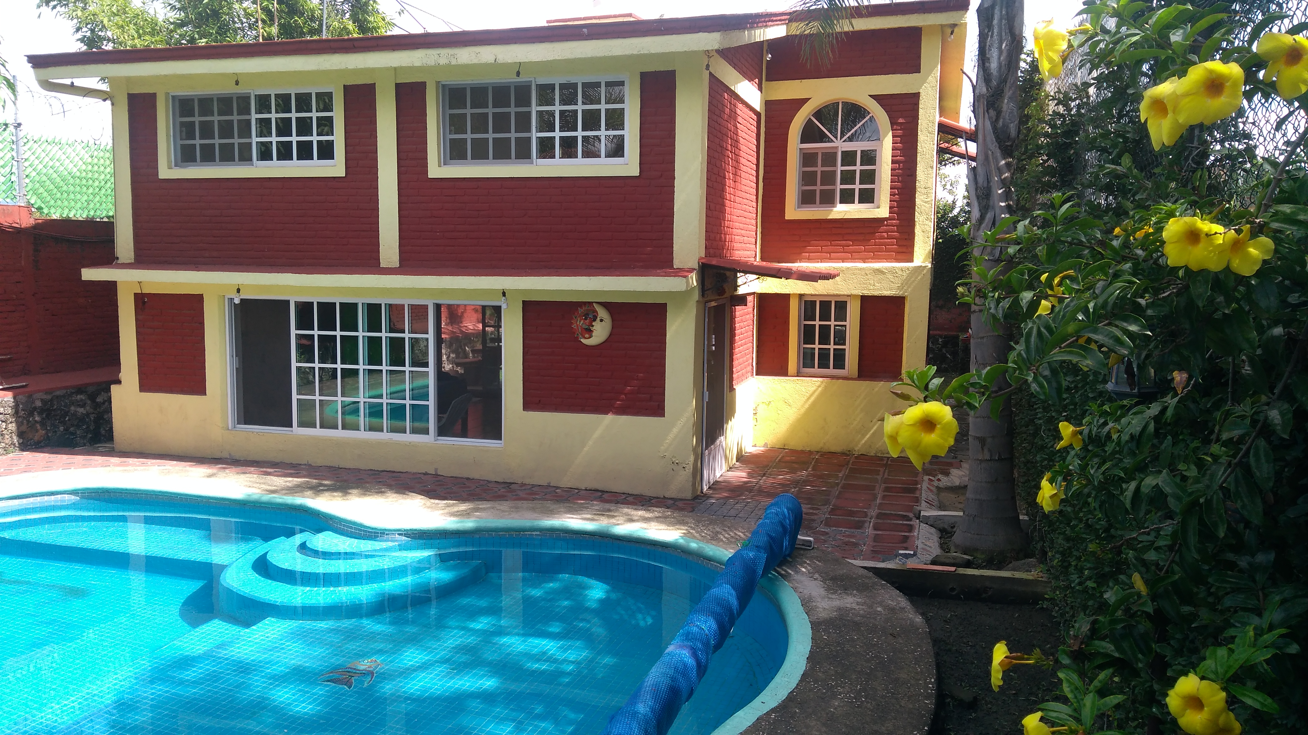 House with a pool and something else.
