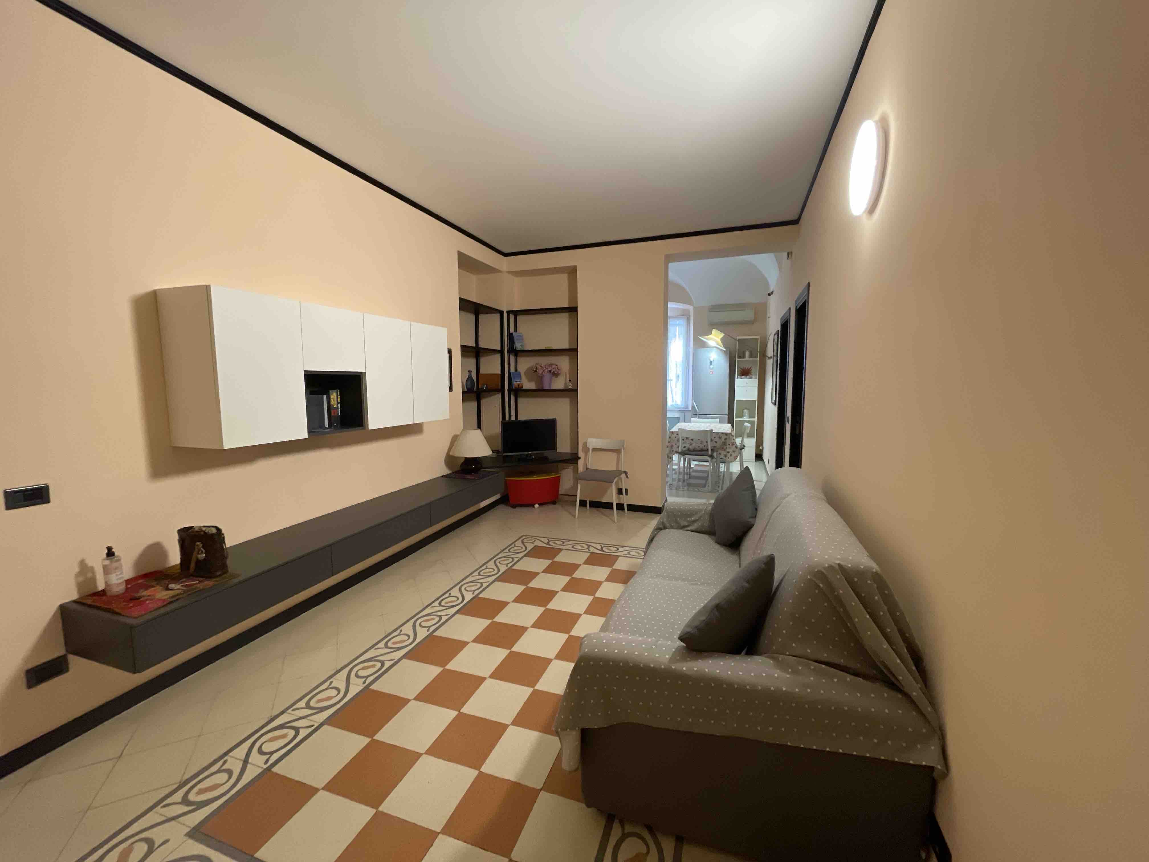 In the caruggio in the heart of downtown, near the sea.
