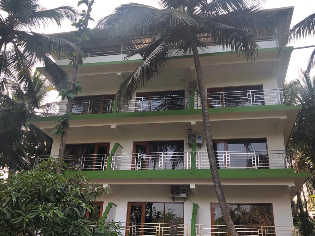 Room with a picture window & balcony
