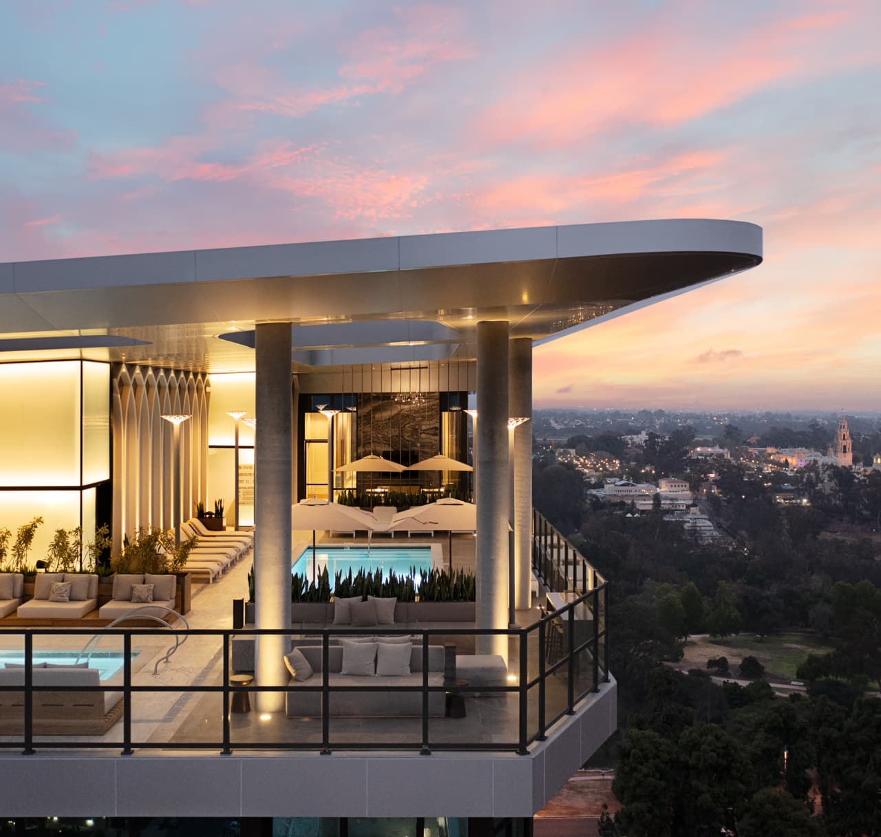 Image of rooftop pool on a city apartment building at dusk