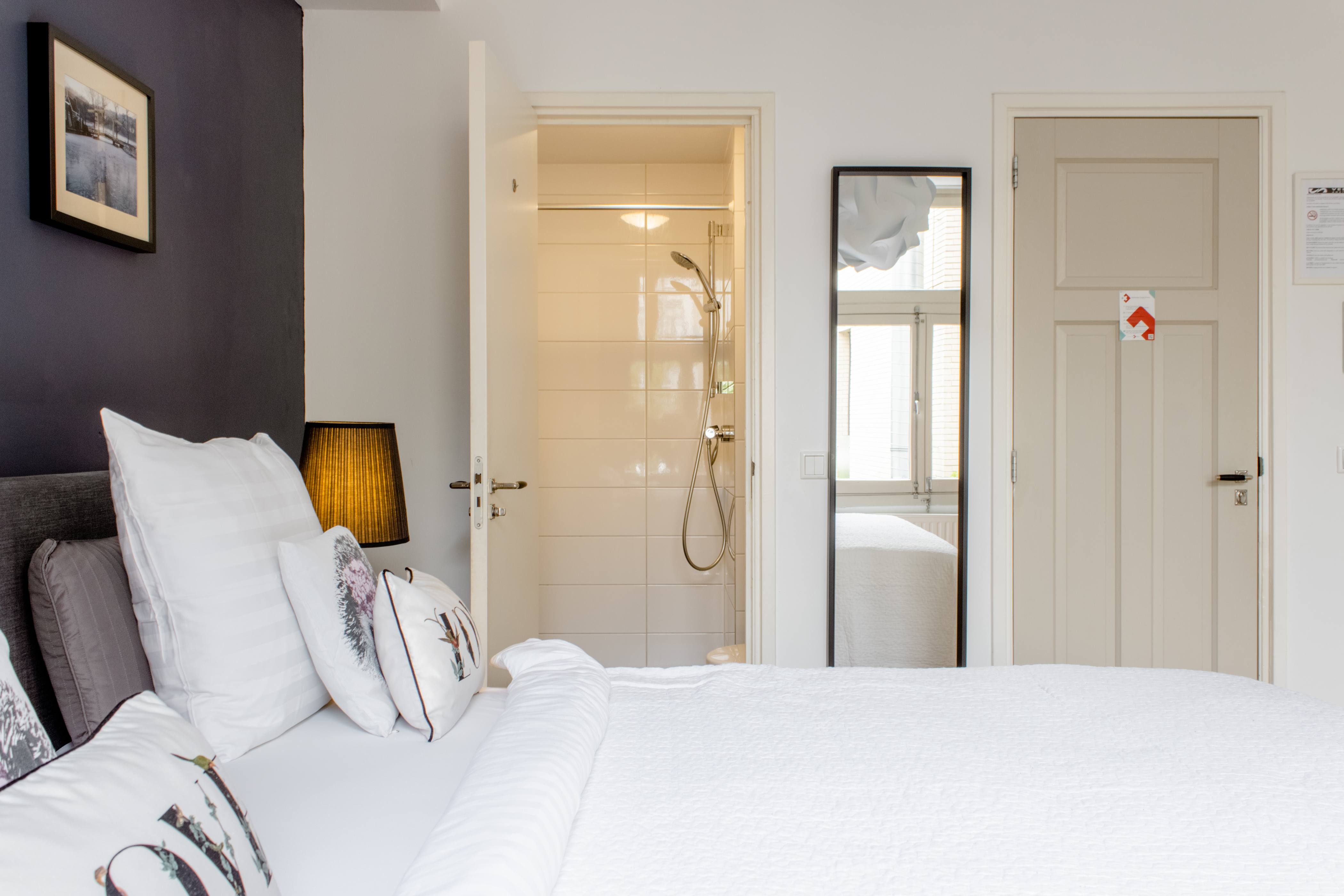 Central, big window, rear room with private bath.