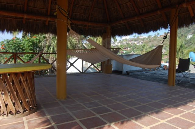 House with palapa and partial ocean view
