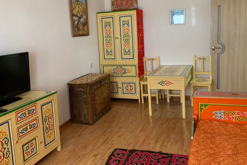 Sun filled apartment with traditional furnishing.