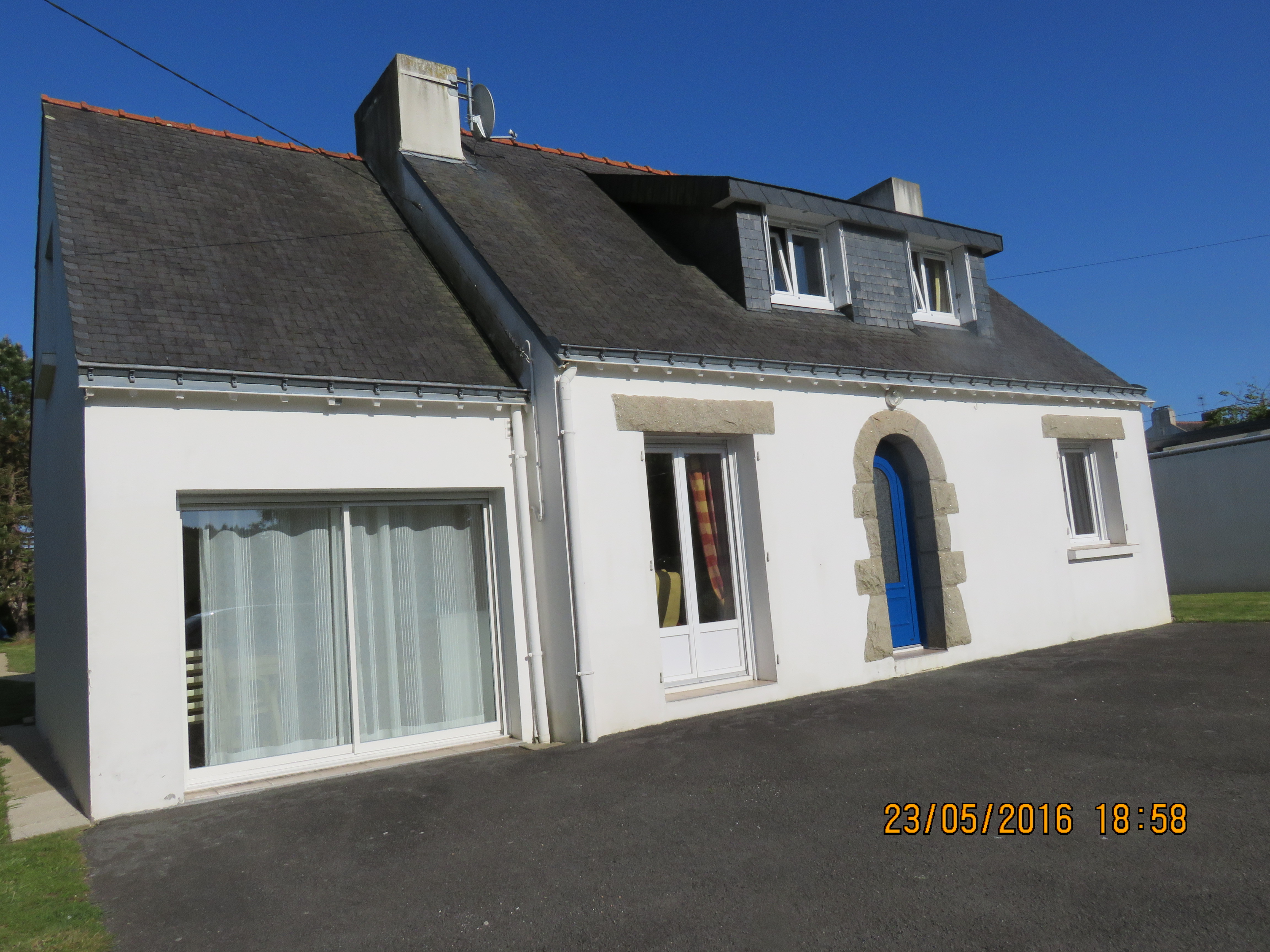 house near sea and village center