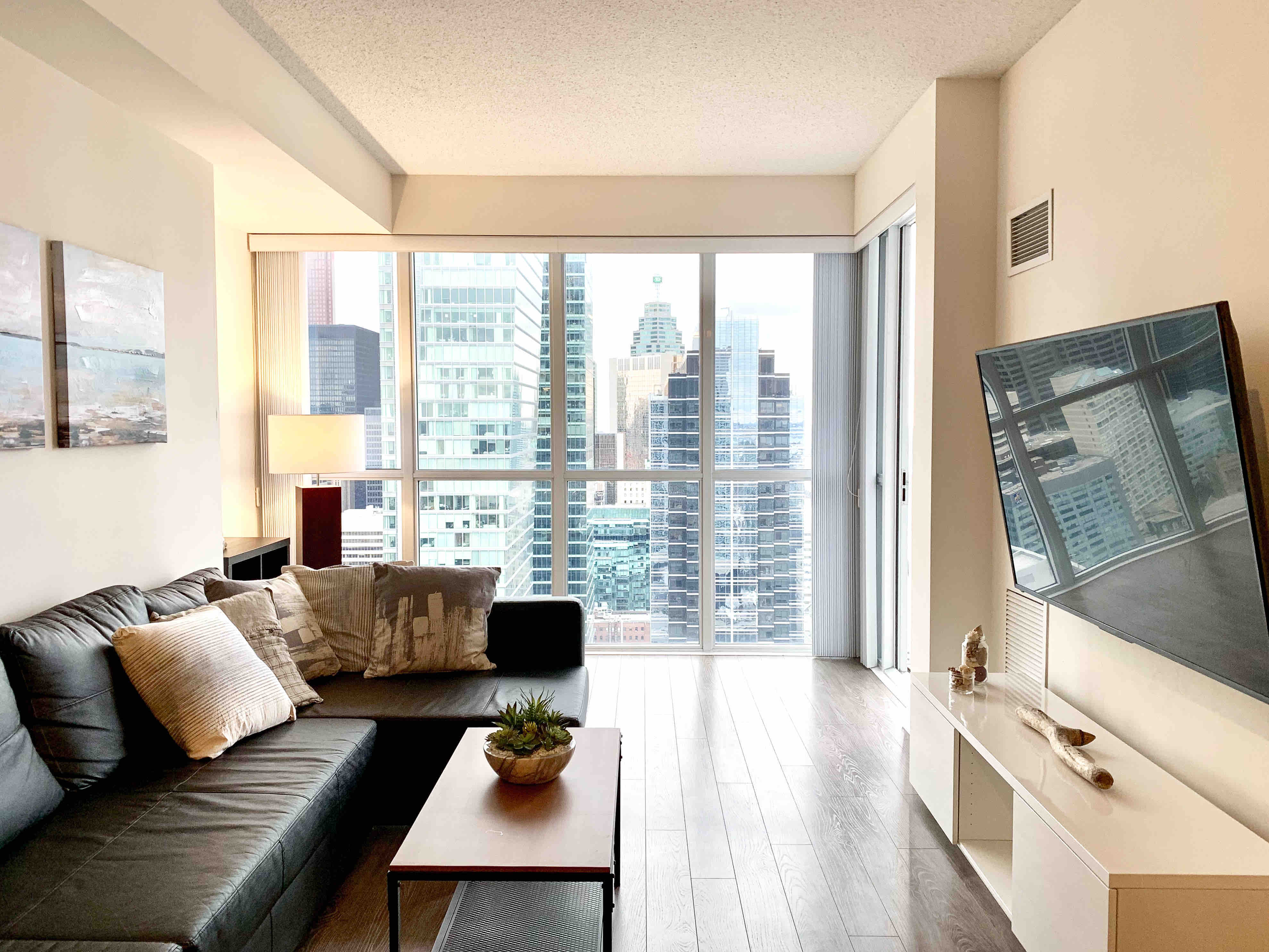 Modern 1+Den condo steps away from CN Tower & Lake