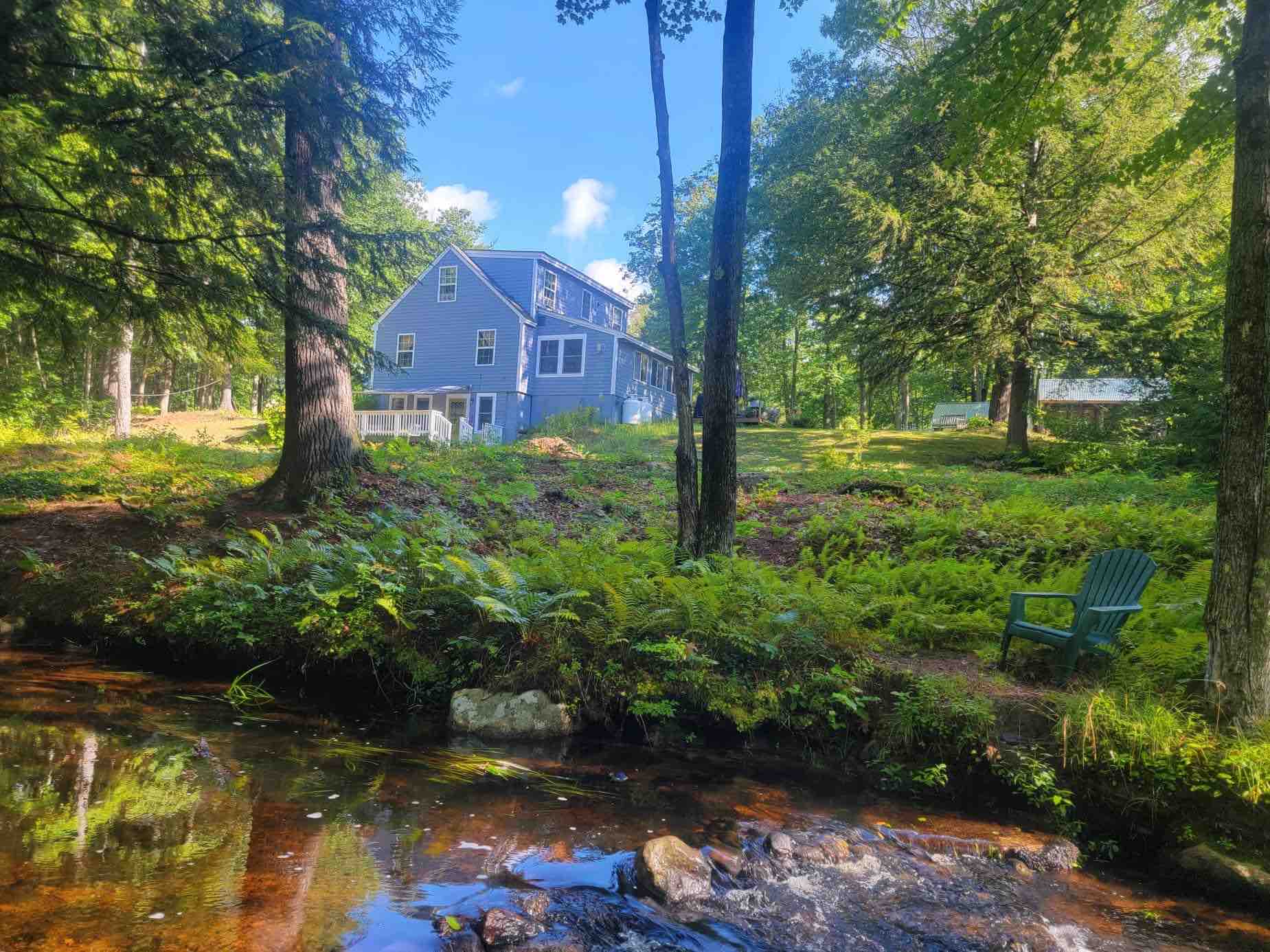 Tamworth cozy cottage on a brook with trails.