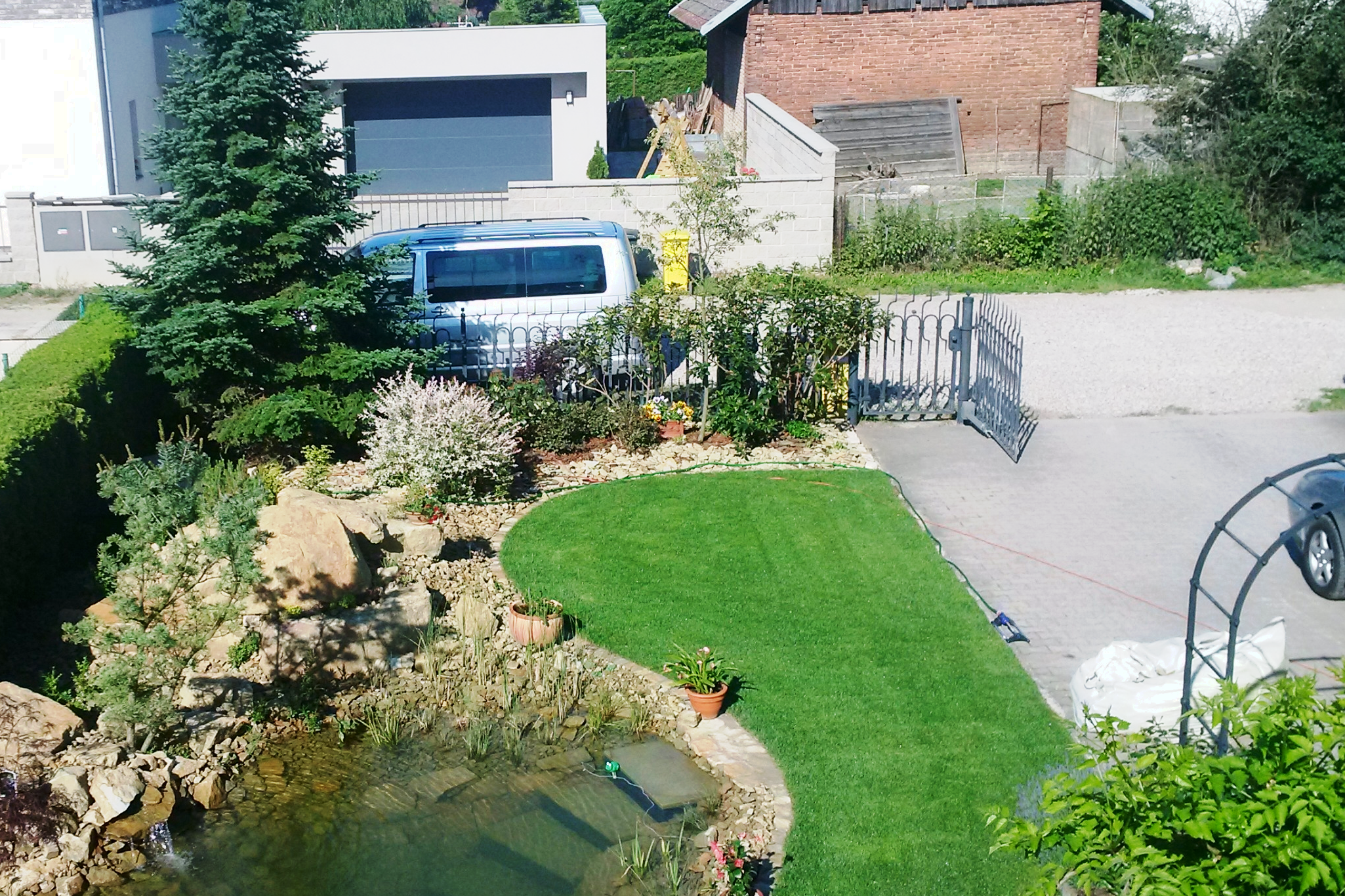 Floor in a family house with a terrace. A silver pond.