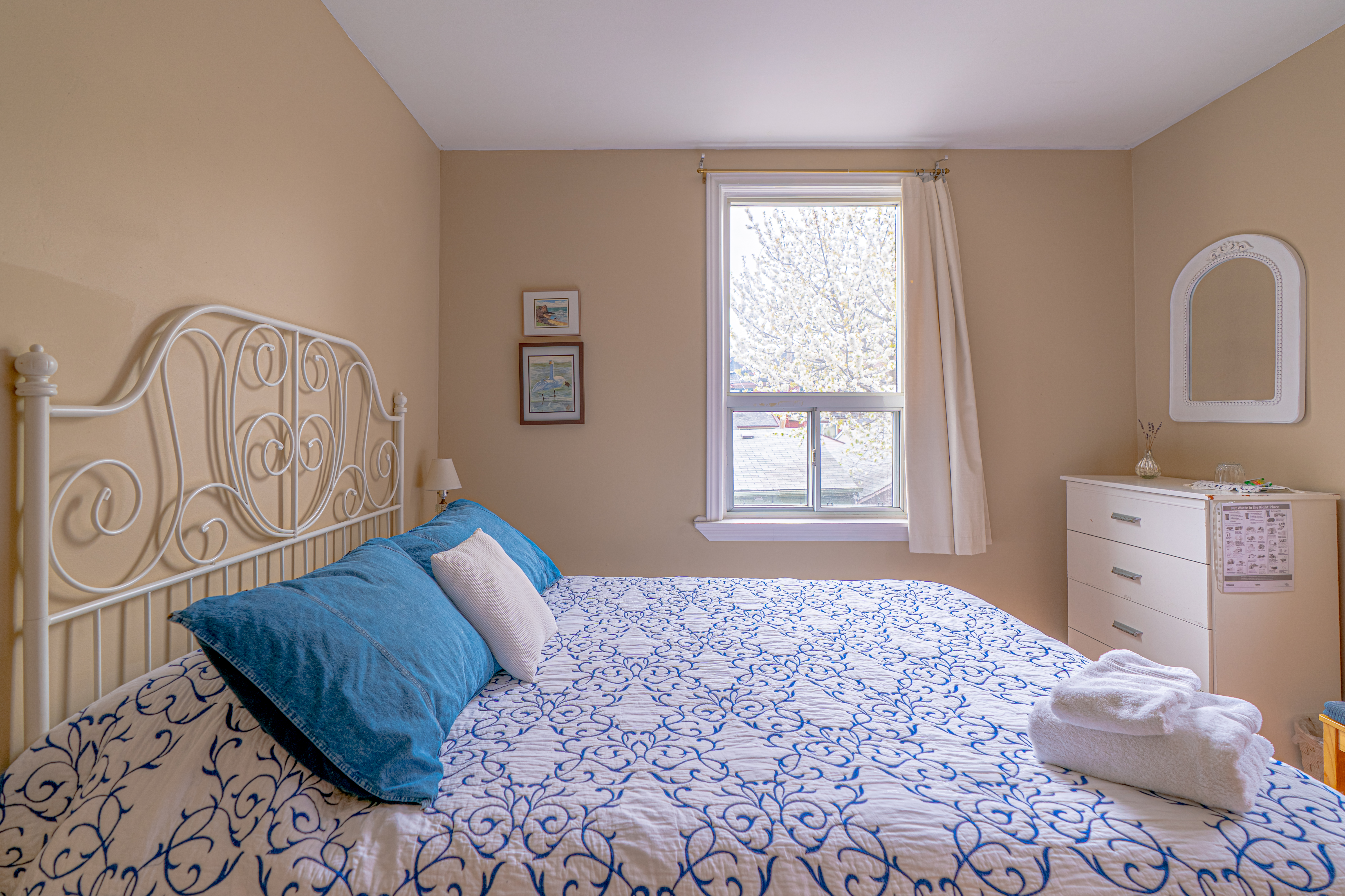 Comfy bed in French Provincial style room