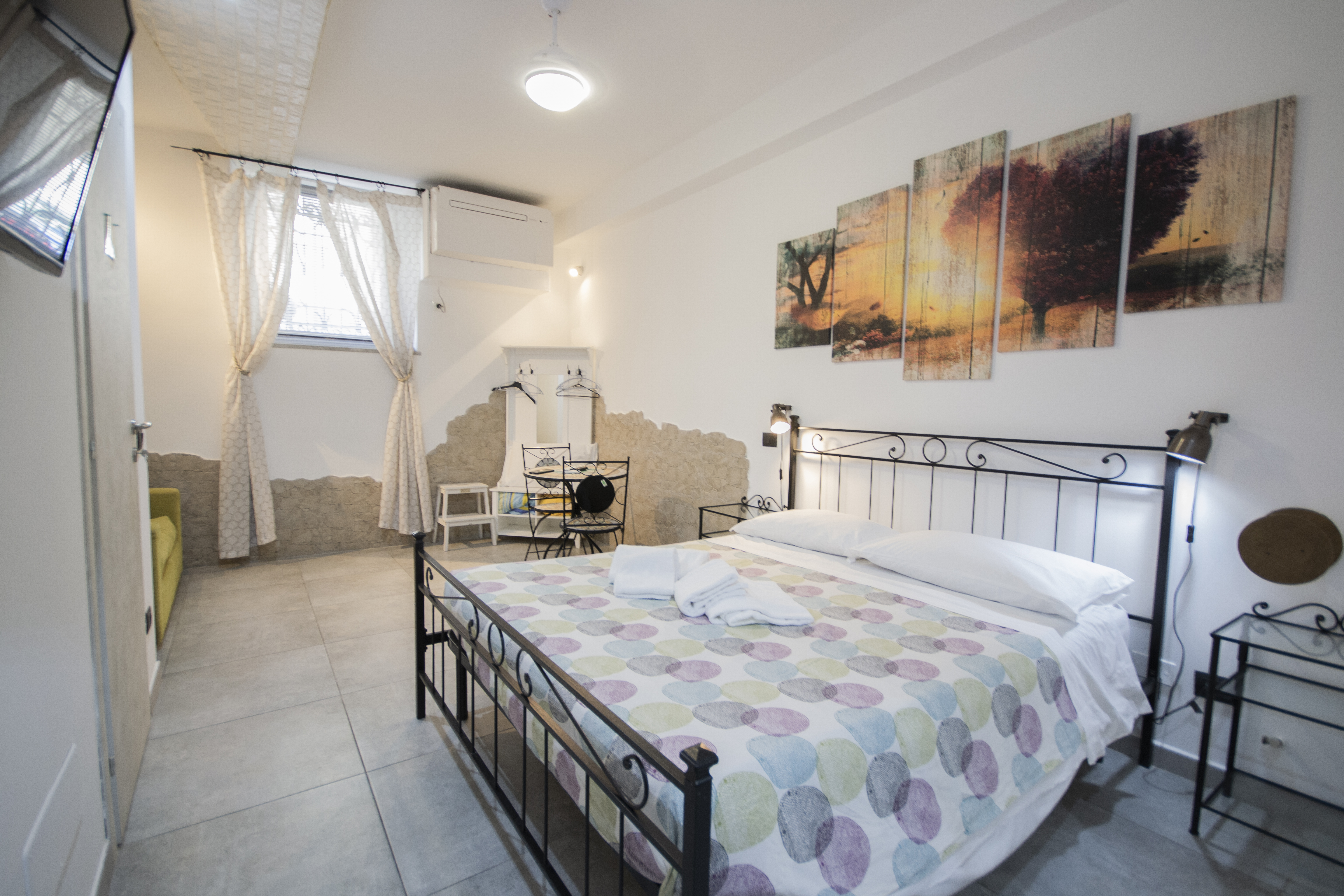Central cozy wide room, private bathroom inside.