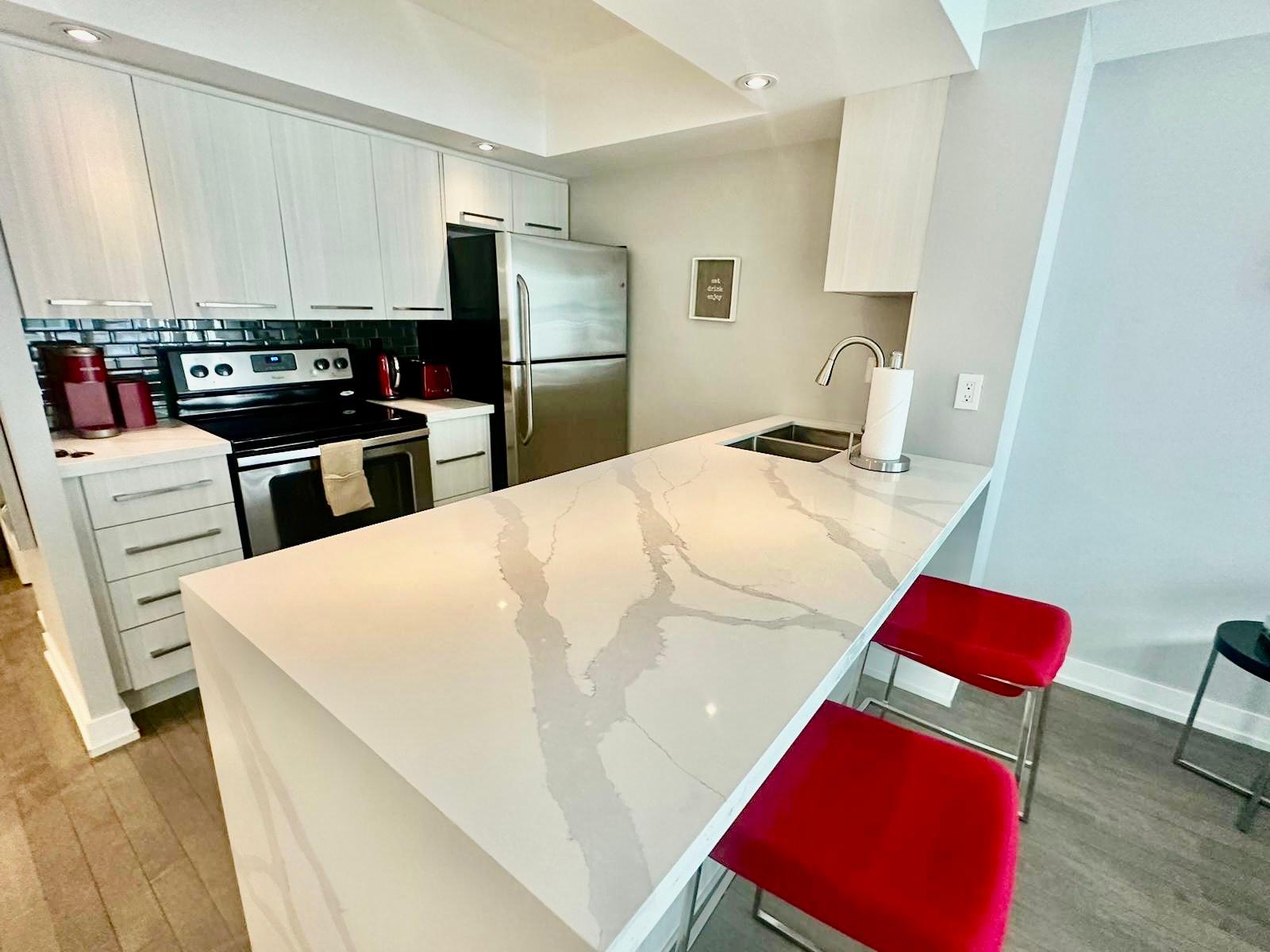 Modern condo steps from City Gems (free parking)