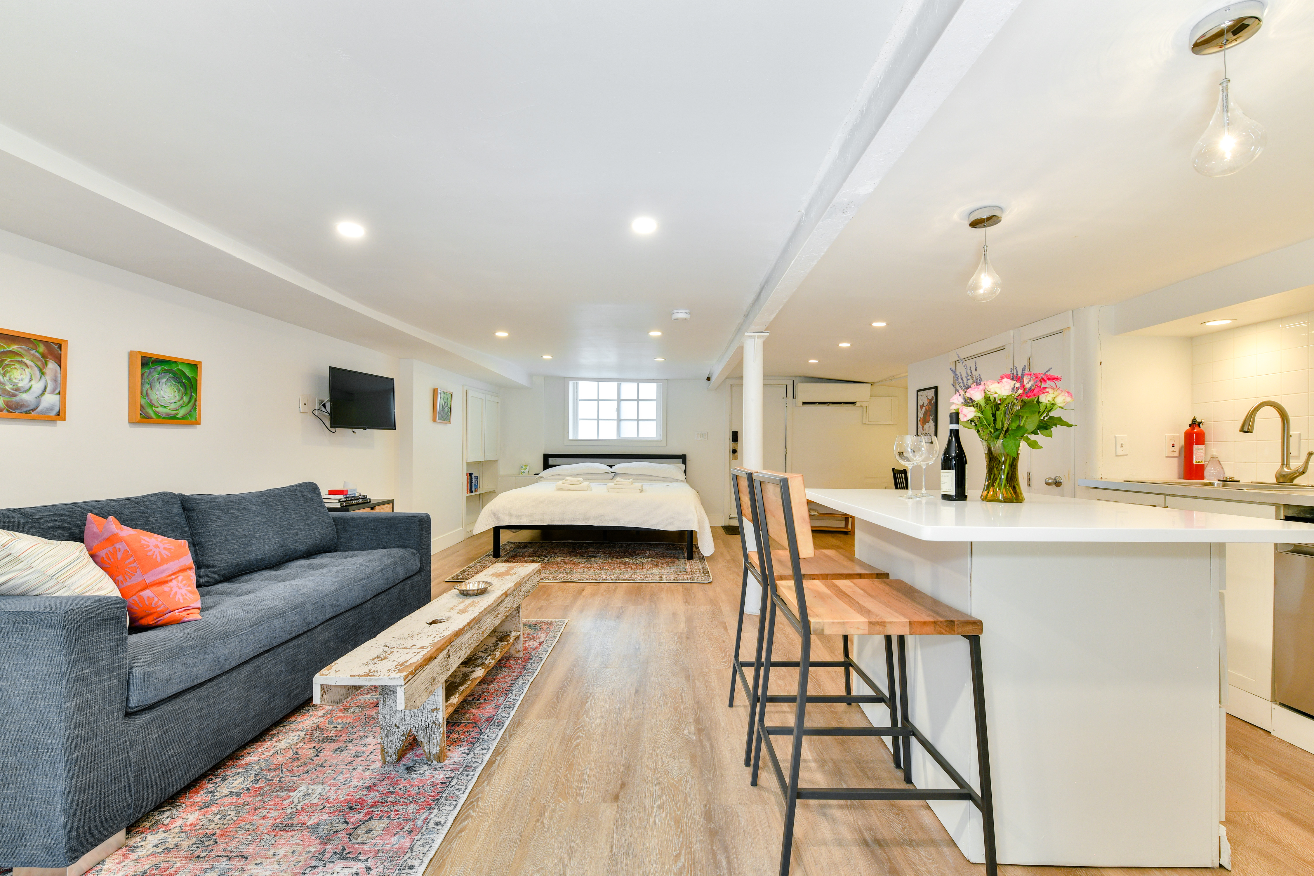 Stylish garden level studio with a private patio