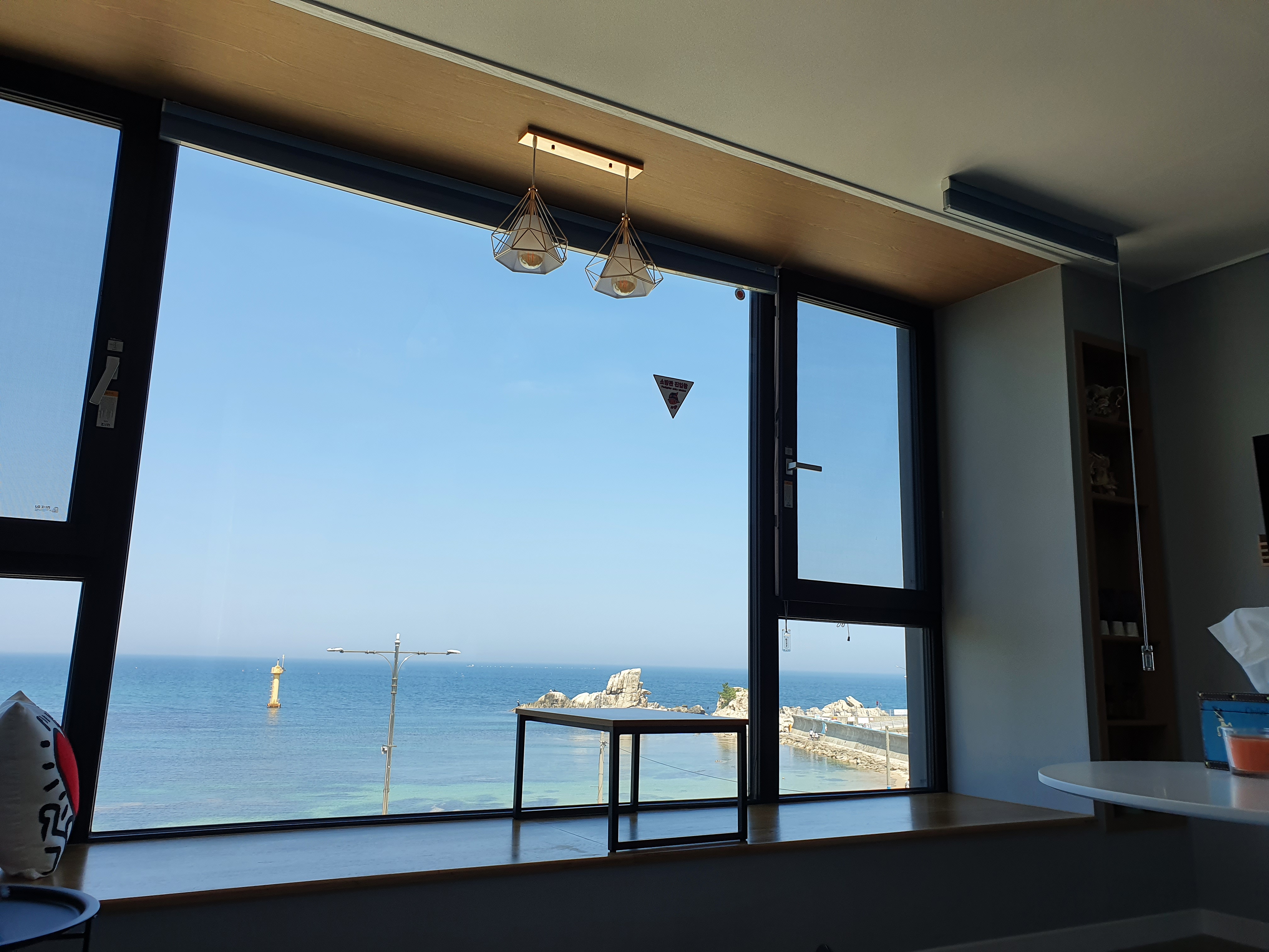 Room 302 with a sea view from the bed.