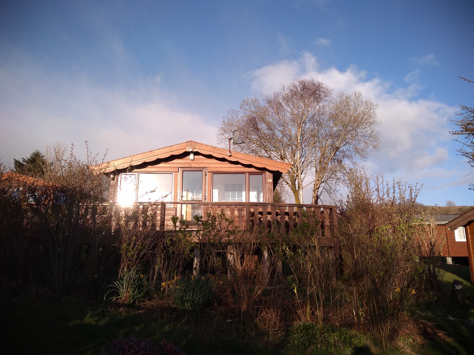 Cosy Log Cabin with sun terrace and mountain views in Bronaber, Wales