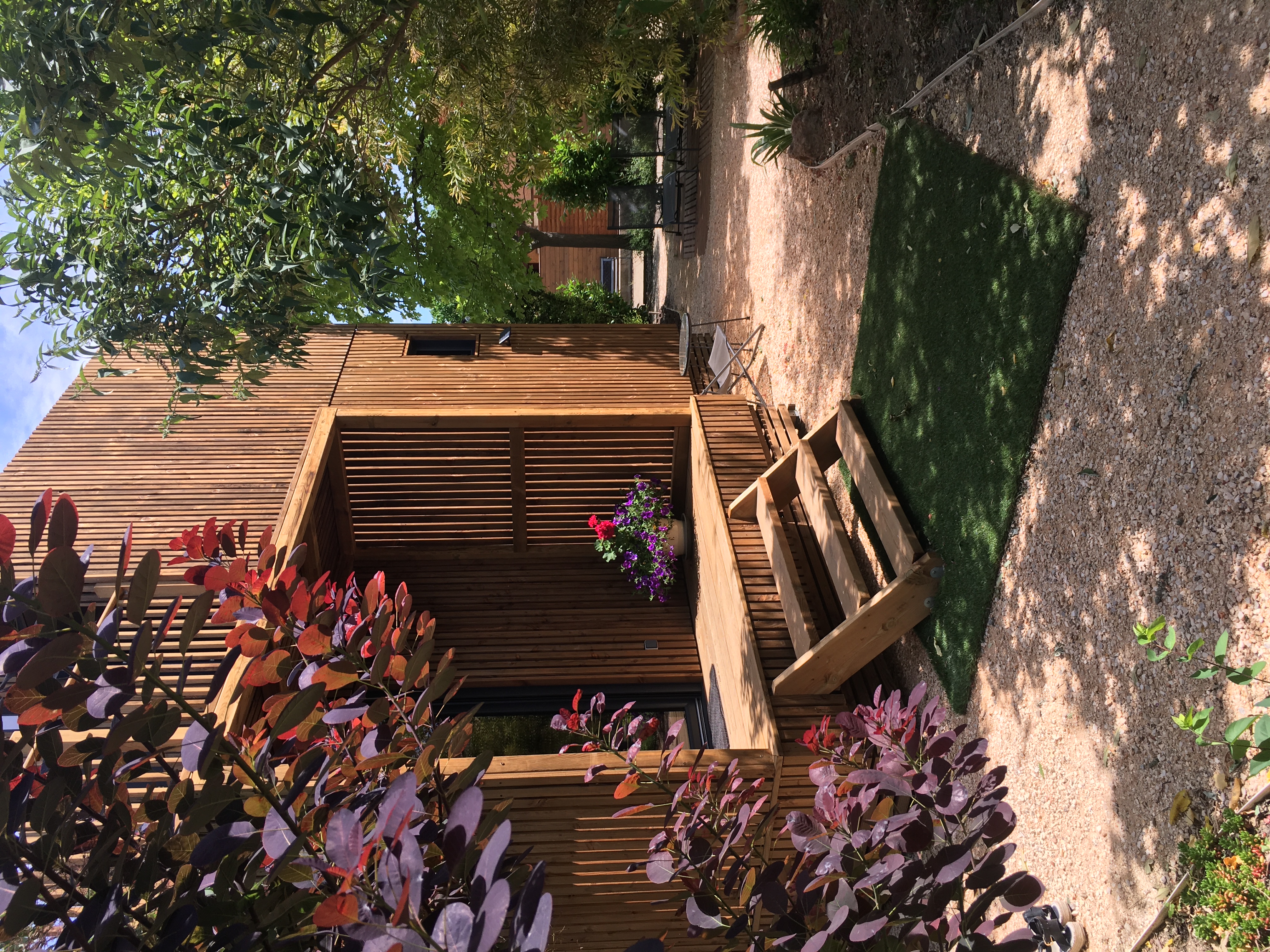 Wooden studio in a green setting