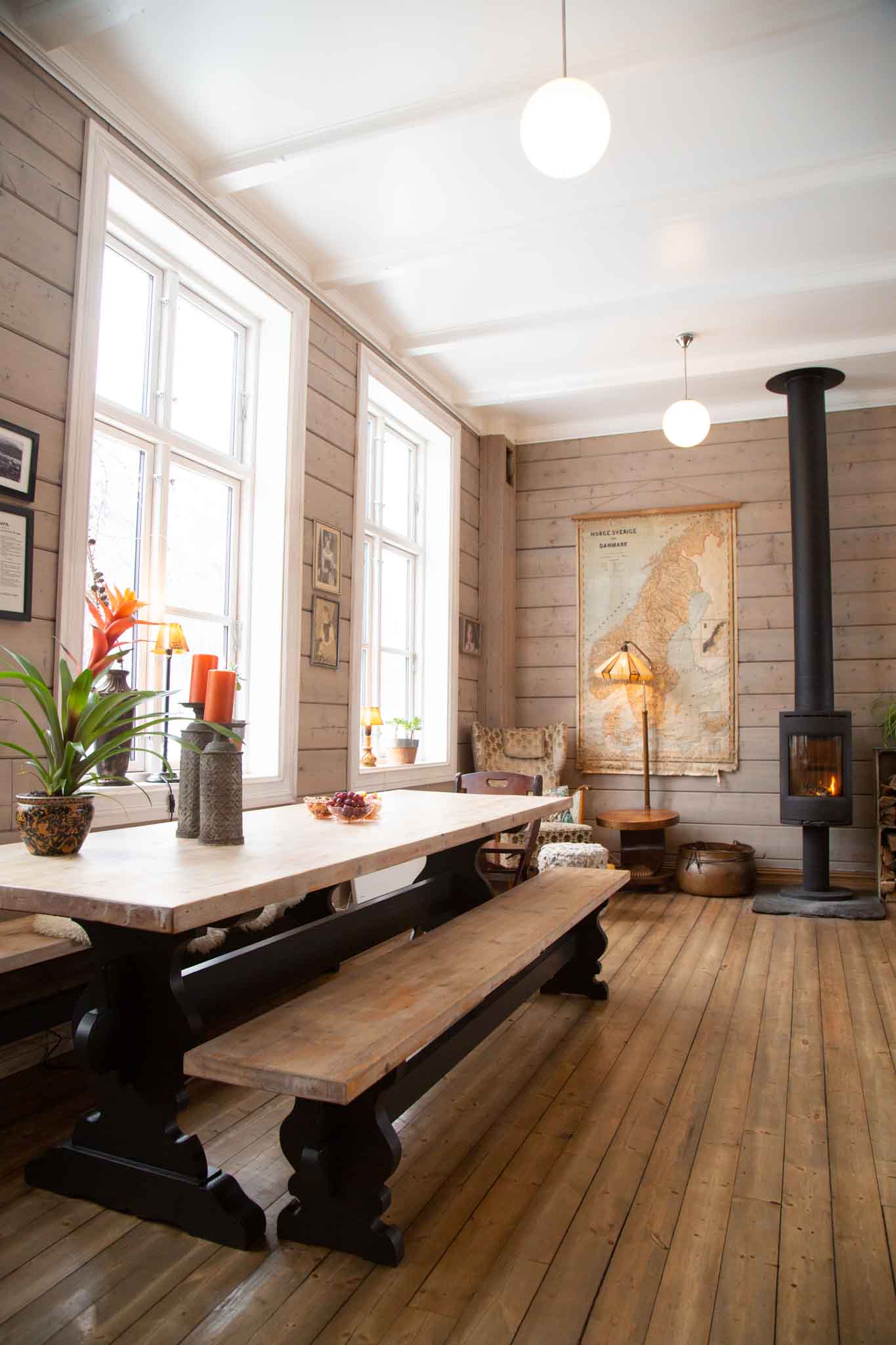Cheerful old school house between forest and fjord