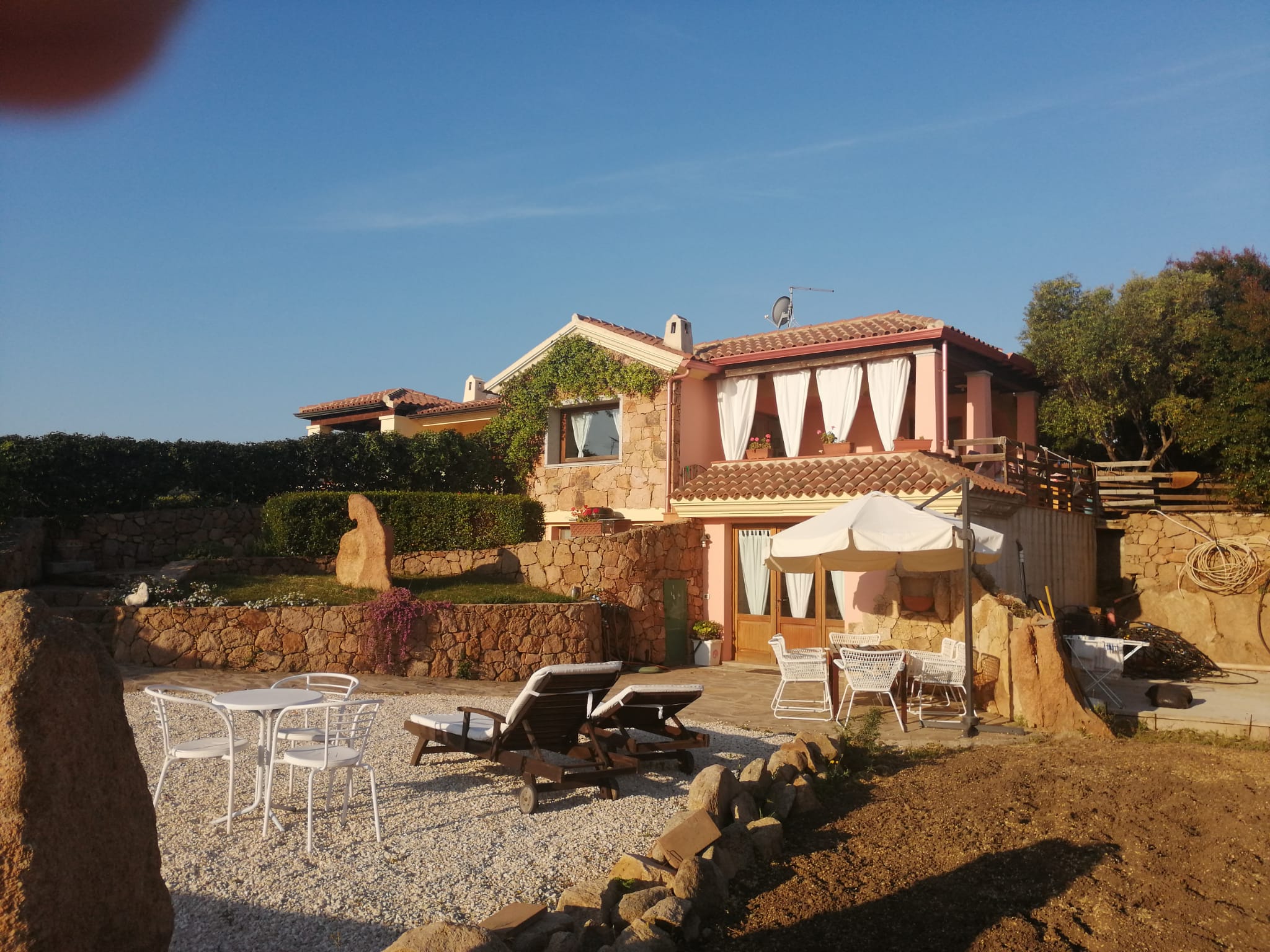 House with a view of the island of  Tavolara ( Sardinia )