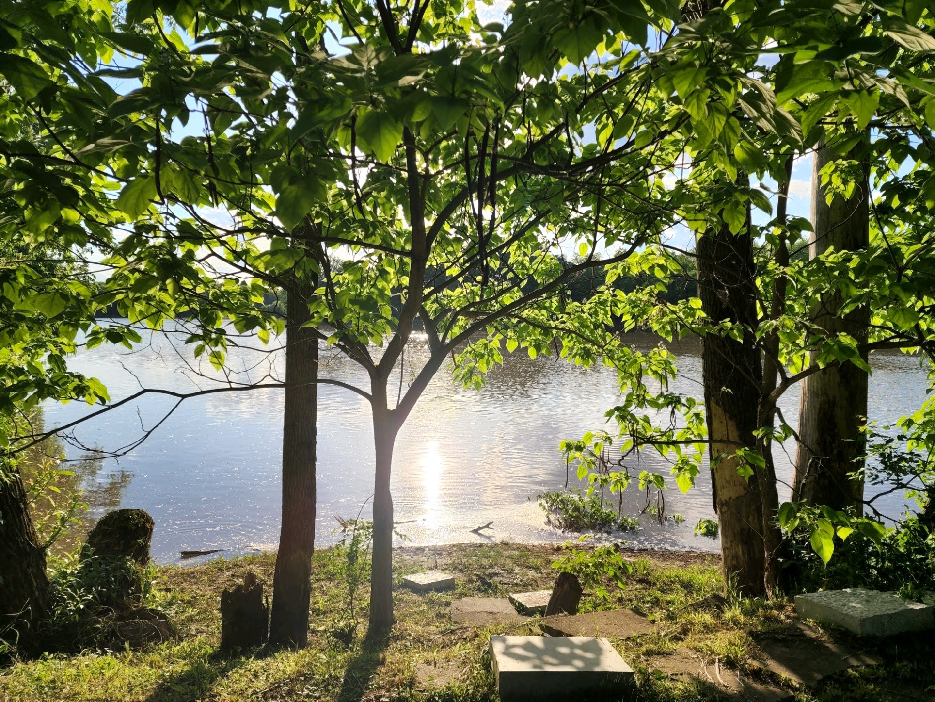 Riverfront camper with kayaks and canoe.