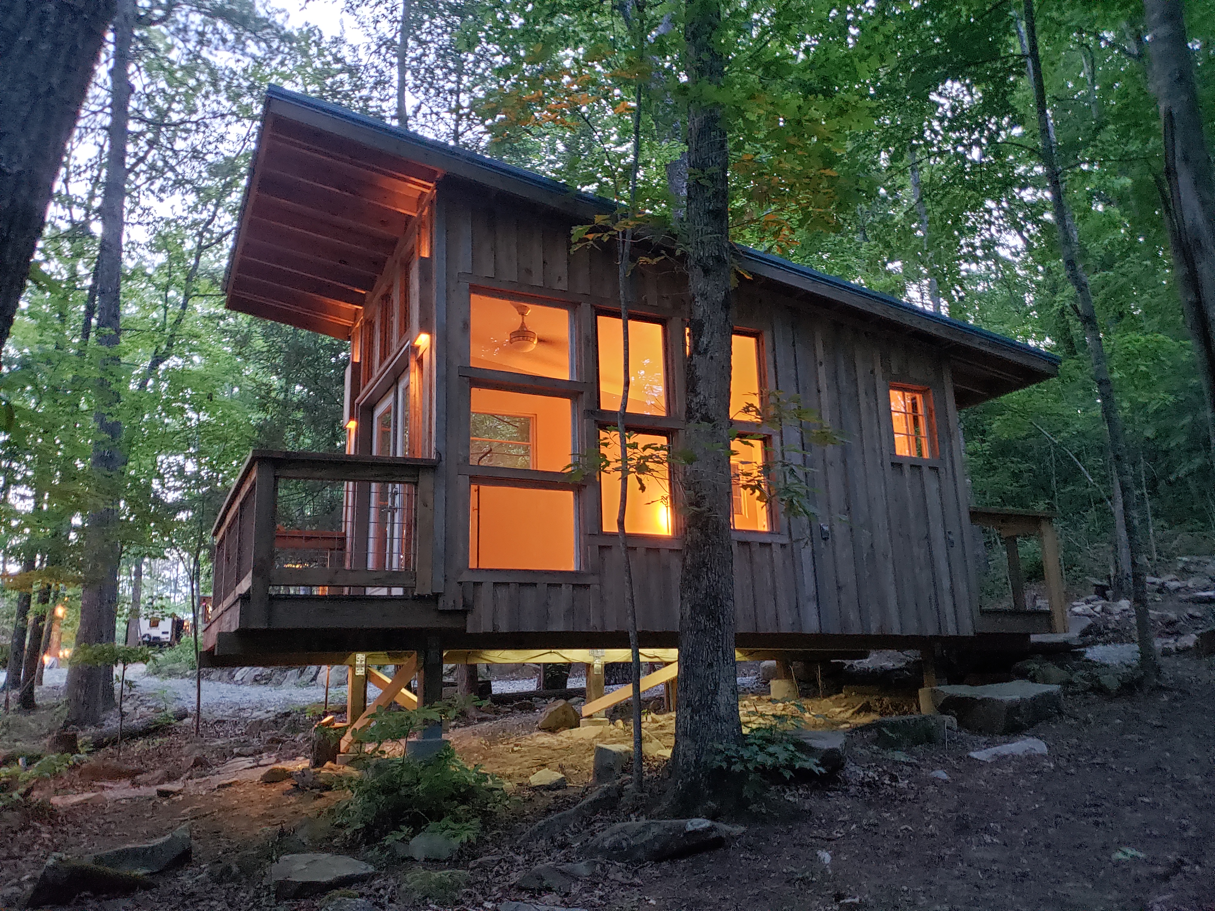 Cozy elevated cabin nested in the woods.