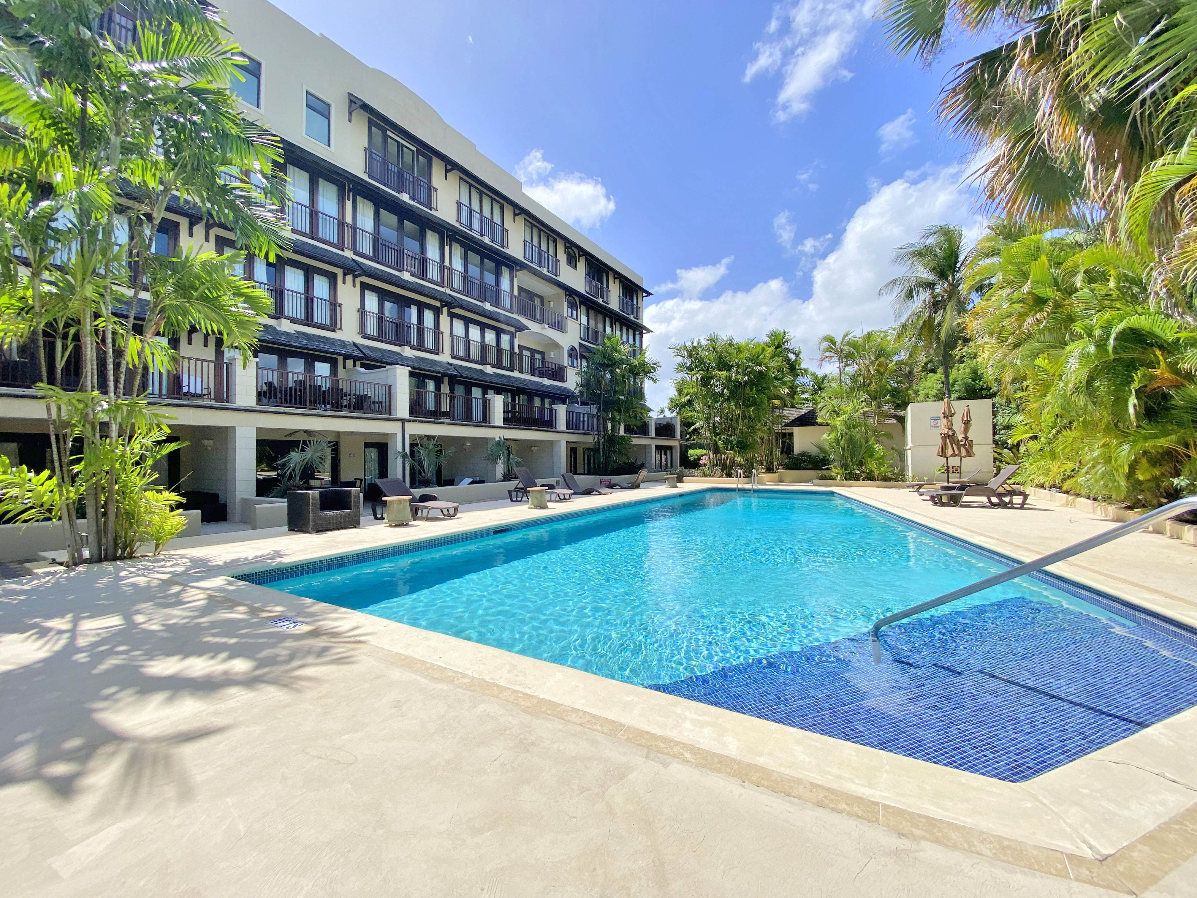 Modern 2 bedroom condo with pool - steps to beach