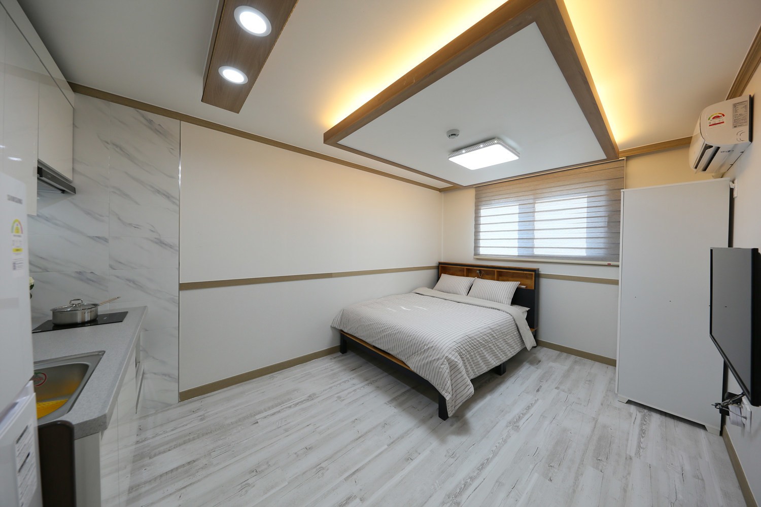 Stylish room 202 with a clean white-tone interior