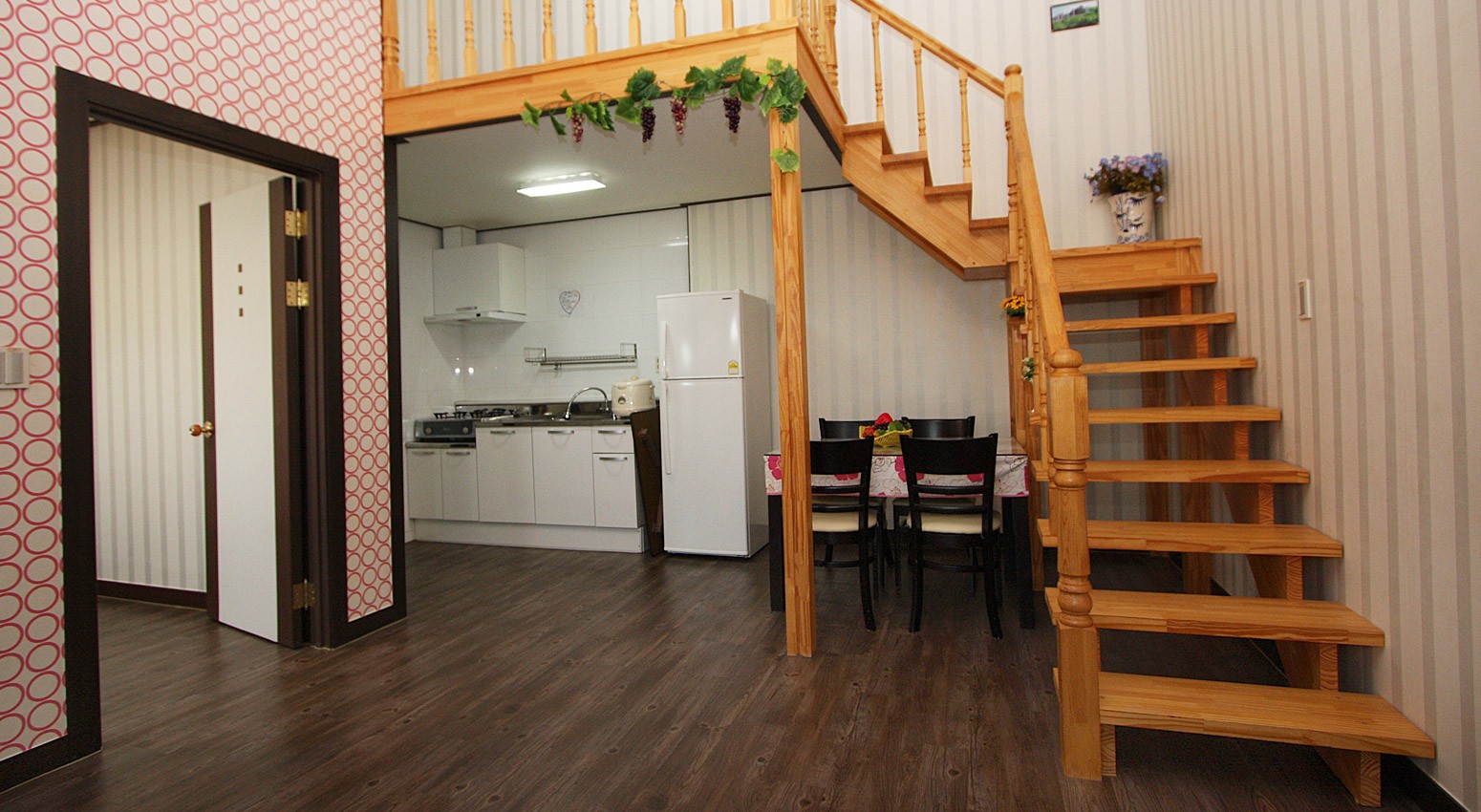 Family in a duplex room with a cute girl's feel with a variety of patterns of yellow interiors